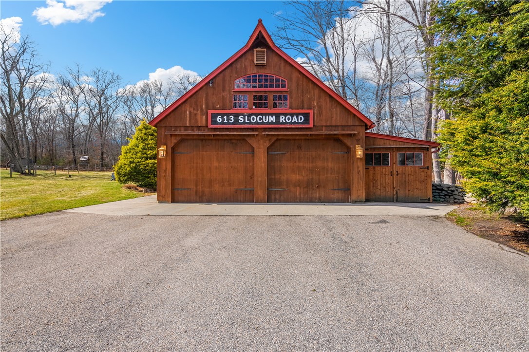613 Slocum Road Exeter, RI 02874 - Photo 37 of 43 4-car garage, with a full staircase to the loft area!