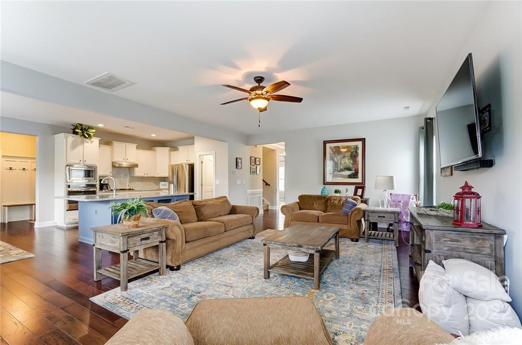 86635 Arrington Road, Unit 116 Lancaster, SC 29720 - Photo 11 of 37 a living room with furniture ceiling fan and a rug