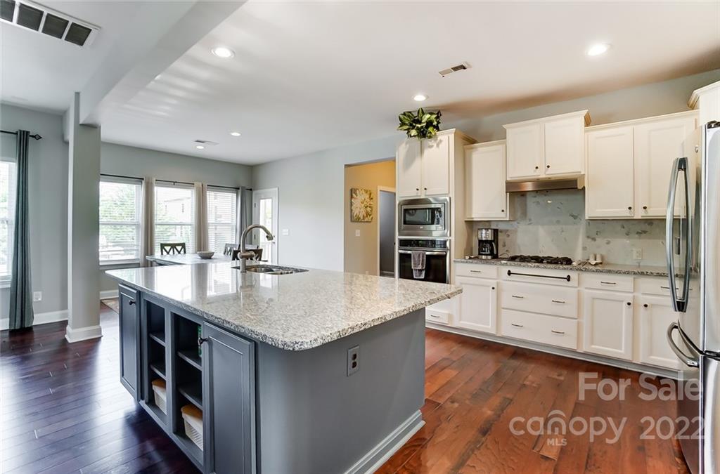 86635 Arrington Road, Unit 116 Lancaster, SC 29720 - Photo 14 of 37 a kitchen with stainless steel appliances granite countertop a sink stove and refrigerator