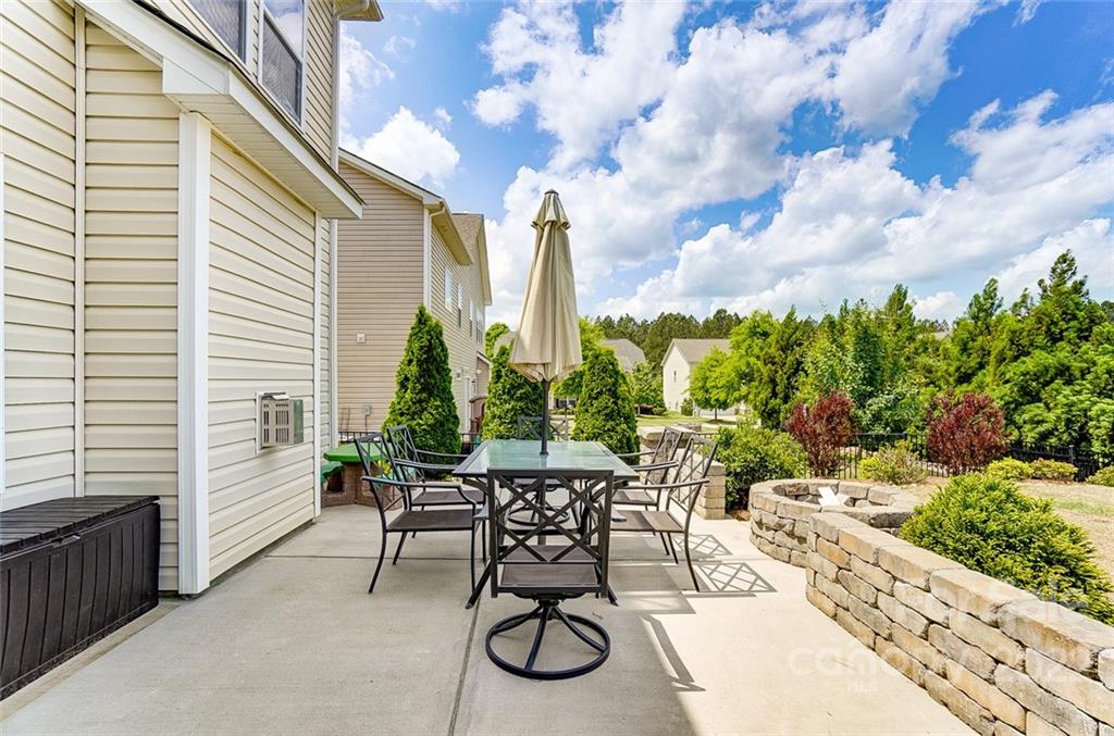 86635 Arrington Road, Unit 116 Lancaster, SC 29720 - Photo 36 of 37 a patio with table and chairs and potted plants