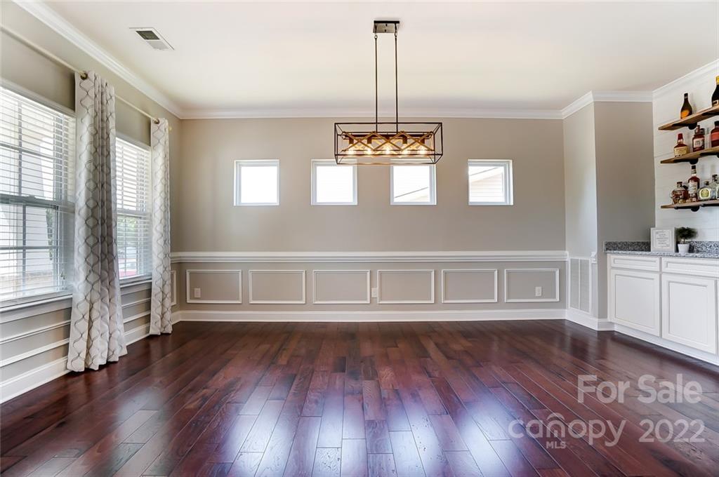 86635 Arrington Road, Unit 116 Lancaster, SC 29720 - Photo 8 of 37 a view of empty room with a window and wooden floor