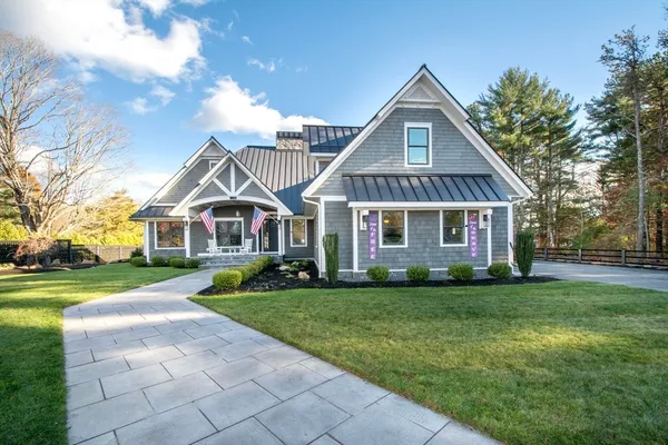 a front view of a house with a yard