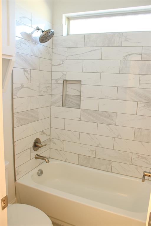 102 Country Road 4511 Decatur, TX 76234 - Photo 17 of 34 a bathroom with a bathtub and a shower