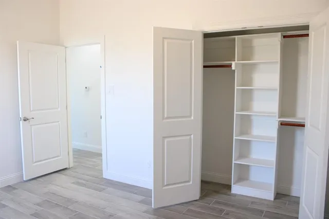 a view of an empty walk in closet
