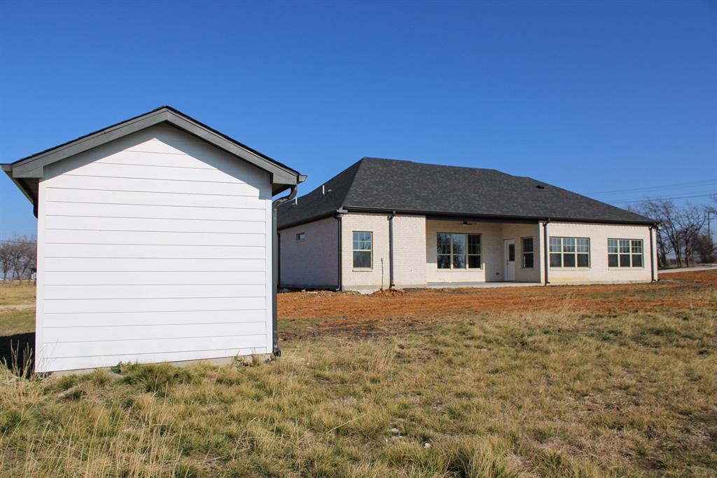 102 Country Road 4511 Decatur, TX 76234 - Photo 30 of 34 a front view of a house with a yard