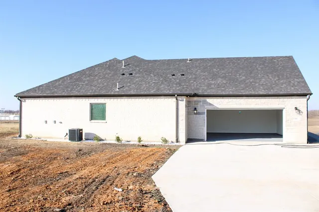 a view of a kitchen with a sink and cabinets