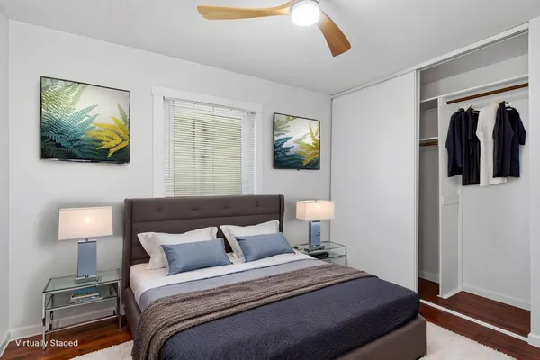 a bedroom with a bed and walk in closet