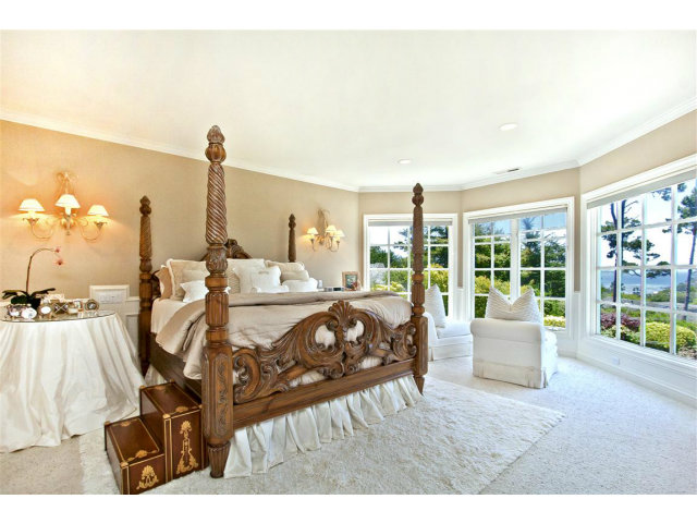 1440 Riata Road Pebble Beach, CA 93953 - Photo 5 of 9 a bedroom with furniture and large windows