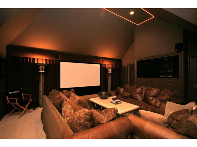 1440 Riata Road Pebble Beach, CA 93953 - Photo 8 of 9 a living room with furniture and a flat screen tv