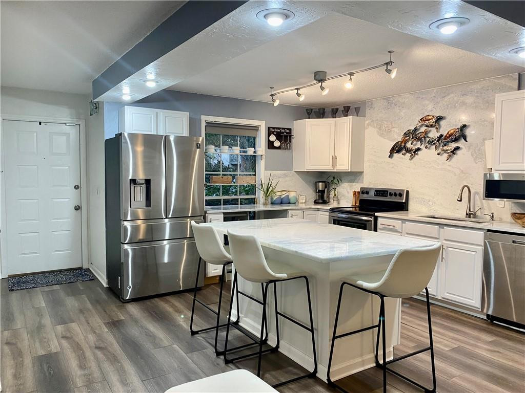 5064 Heatherhill Lane, Unit 2103 Boca Raton, FL 33486 - Photo 2 of 25 Updated open kitchen with island.