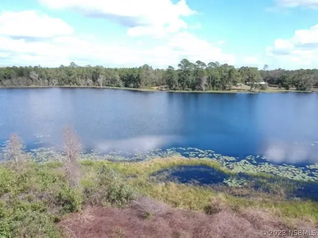 a view of a lake with a mountain in the background