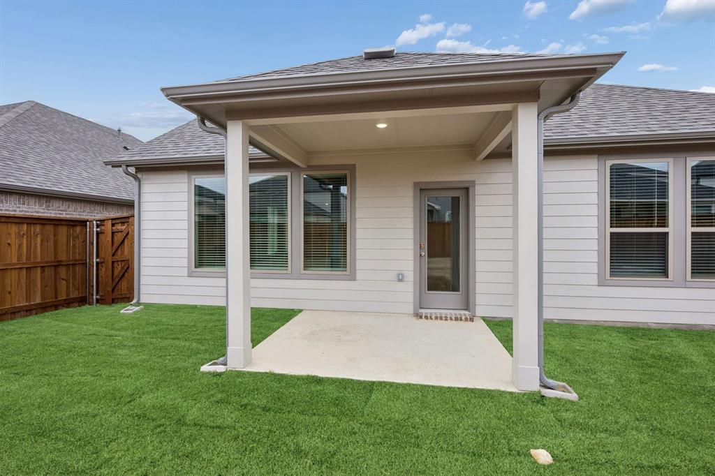 2109 Sunshining Road Princeton, TX 75407 - Photo 29 of 35 Covered Patio in the Stanley II home plan by Trophy Signature Homes – REPRESENTATIVE PHOTO