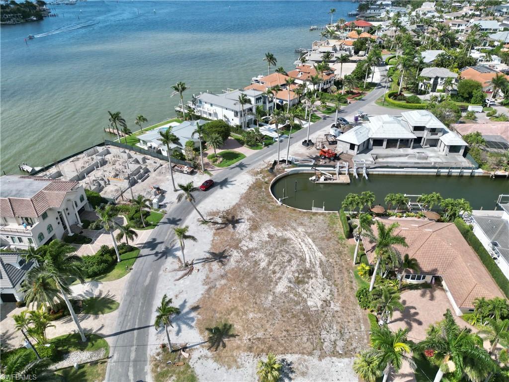 2001 Kingfish Road Naples, FL 34102 - Photo 11 of 24 a view of a house with a yard