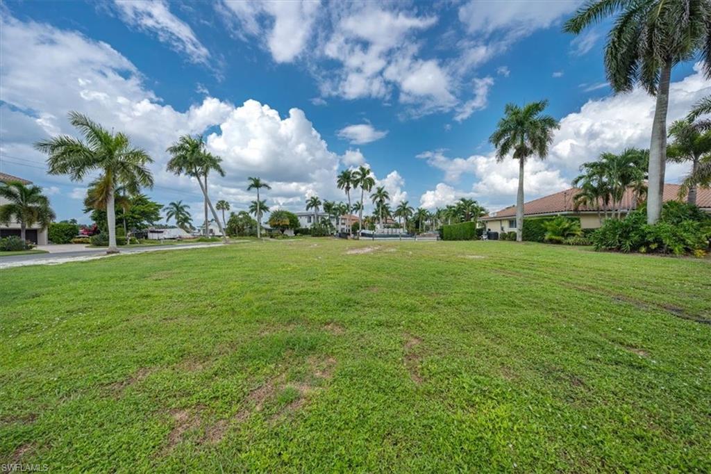 2001 Kingfish Road Naples, FL 34102 - Photo 13 of 24 a view of a building and trees in the background