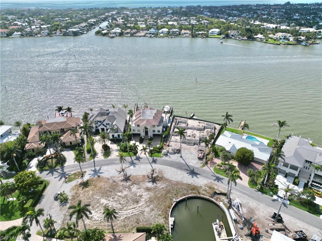2001 Kingfish Road Naples, FL 34102 - Photo 2 of 24 an aerial view of a house with a lake view