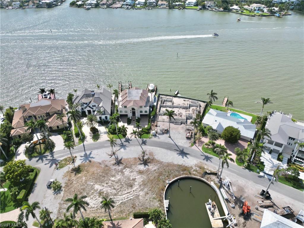 2001 Kingfish Road Naples, FL 34102 - Photo 21 of 24 an aerial view of a house with a lake view