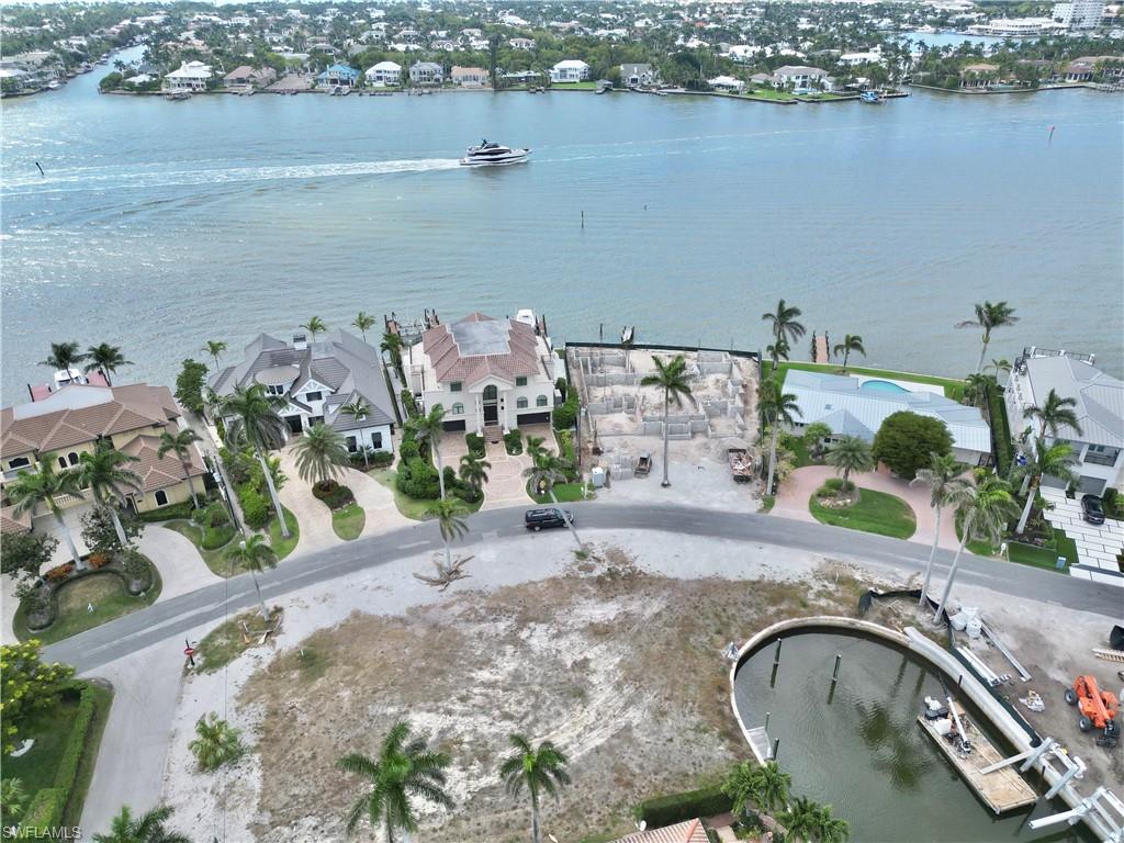 2001 Kingfish Road Naples, FL 34102 - Photo 23 of 24 an aerial view of a house with a lake view