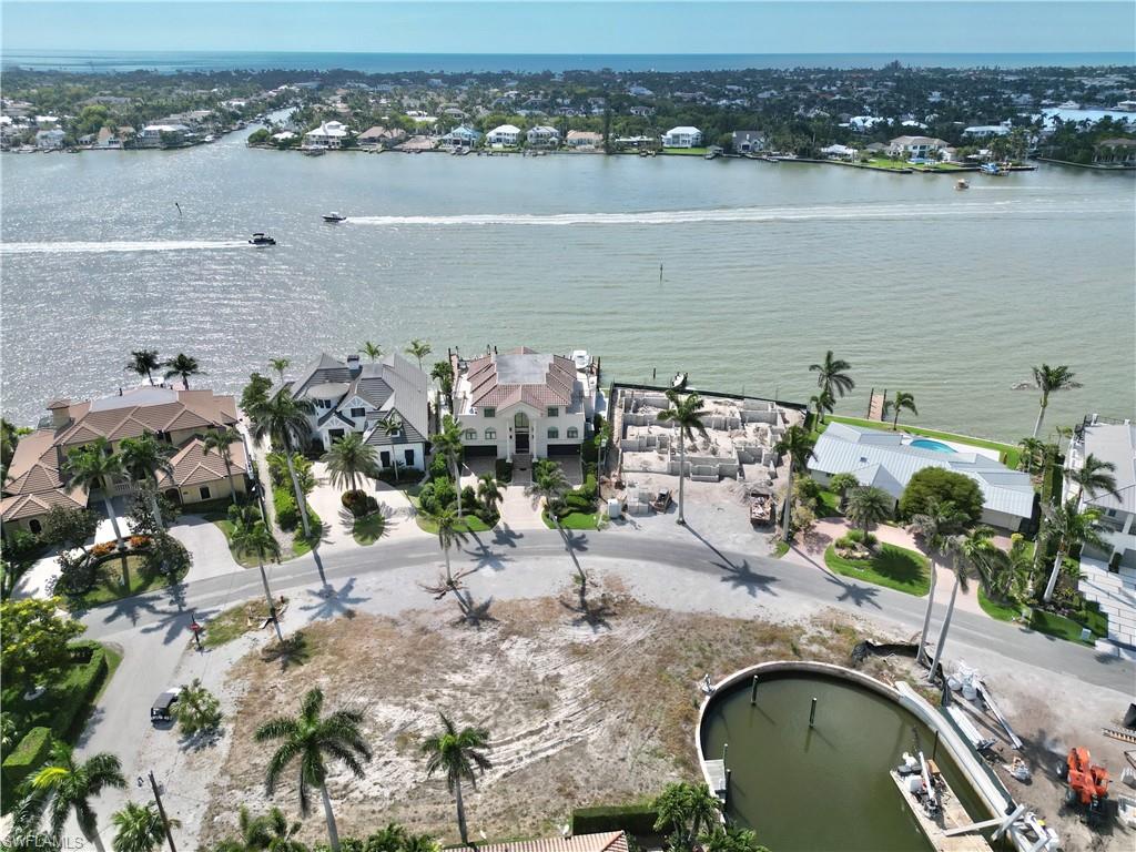 2001 Kingfish Road Naples, FL 34102 - Photo 4 of 24 an aerial view of a house with a lake view