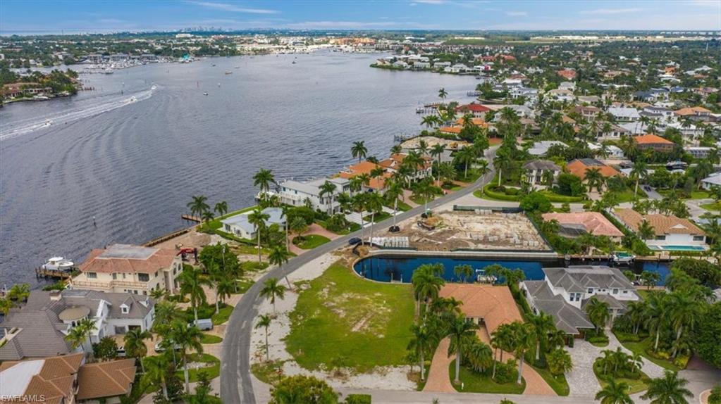 2001 Kingfish Road Naples, FL 34102 - Photo 5 of 24 an aerial view of a house with a lake view