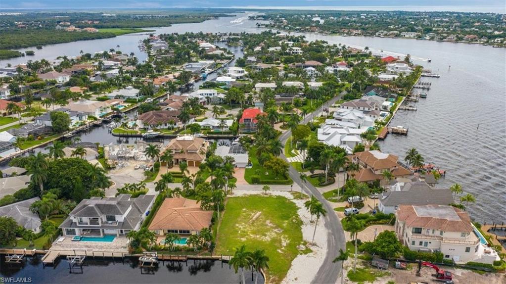 2001 Kingfish Road Naples, FL 34102 - Photo 6 of 24 an aerial view of residential houses with outdoor space and river