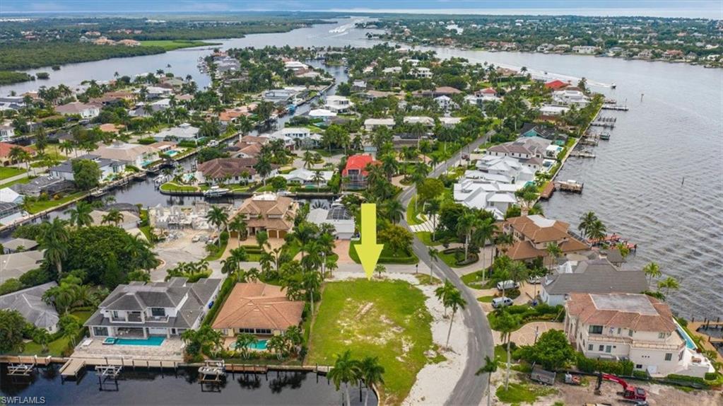 2001 Kingfish Road Naples, FL 34102 - Photo 7 of 24 an aerial view of residential houses with outdoor space and river