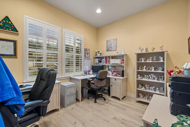 a bathroom with a sink mirror and toilet