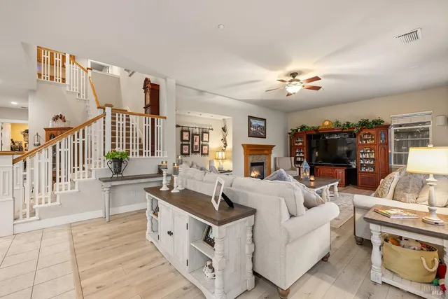 a kitchen with stainless steel appliances granite countertop a sink refrigerator and cabinets