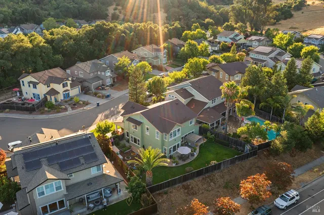 an aerial view of residential houses and outdoor space