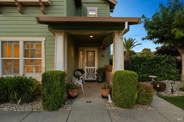 a front view of a house with garden