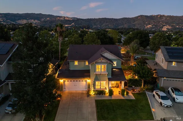 a dining room with furniture entryway and wooden floor