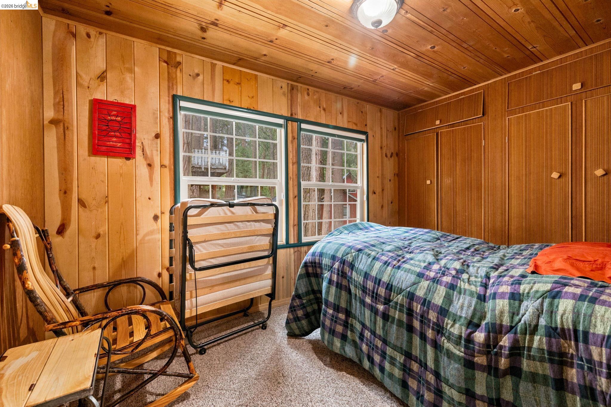 25822 Long Barn Sugar Pine Road Long Barn, CA 95335 - Photo 16 of 28 a bedroom with a bed and a window