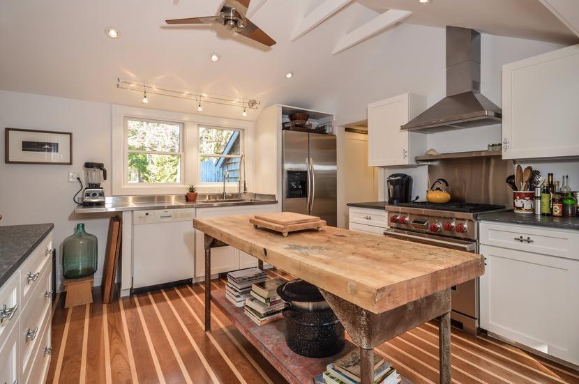 59 Lewis Pond Road Cotuit, MA 02635 - Photo 1 of 24 a kitchen with a stove a sink dishwasher and a refrigerator