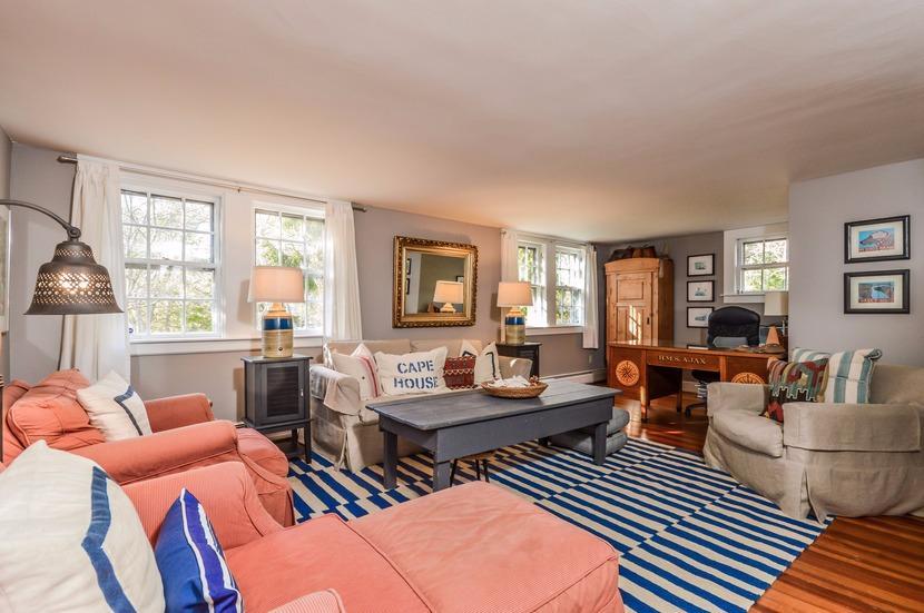 59 Lewis Pond Road Cotuit, MA 02635 - Photo 12 of 24 a living room with furniture and a potted plant