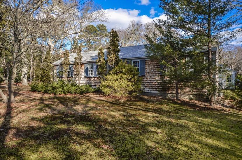 59 Lewis Pond Road Cotuit, MA 02635 - Photo 16 of 24 a view of a house with a yard