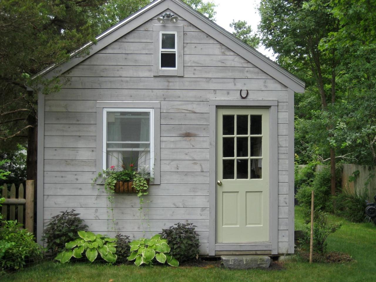 59 Lewis Pond Road Cotuit, MA 02635 - Photo 18 of 24 a front view of a house with garden