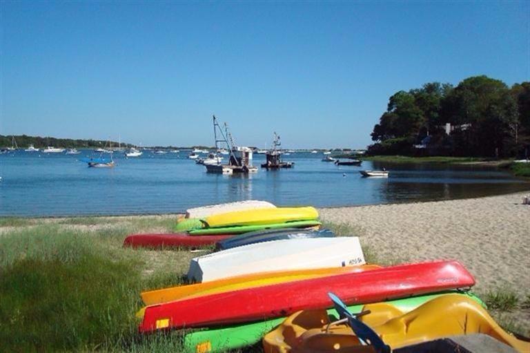 59 Lewis Pond Road Cotuit, MA 02635 - Photo 20 of 24 swimming pool view with a lake view