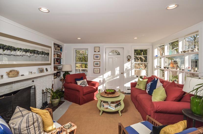 59 Lewis Pond Road Cotuit, MA 02635 - Photo 3 of 24 a living room with furniture fireplace and a window