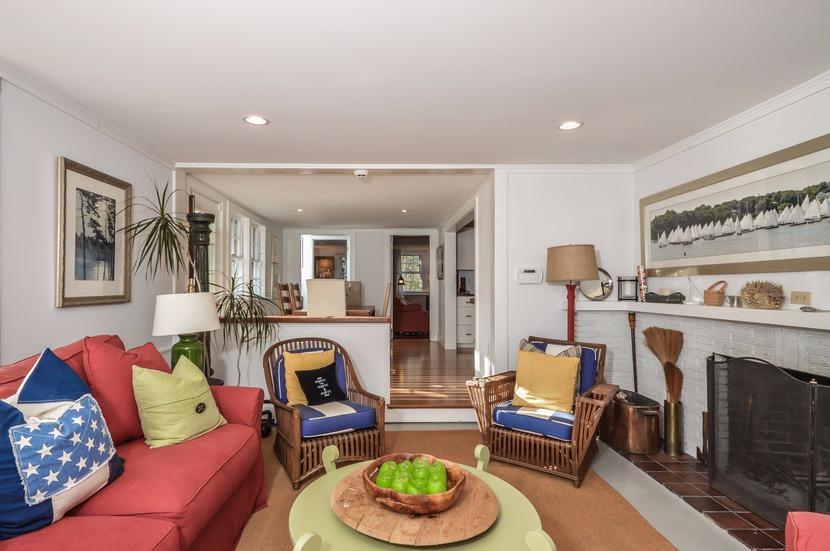 59 Lewis Pond Road Cotuit, MA 02635 - Photo 4 of 24 a living room with furniture and a fireplace