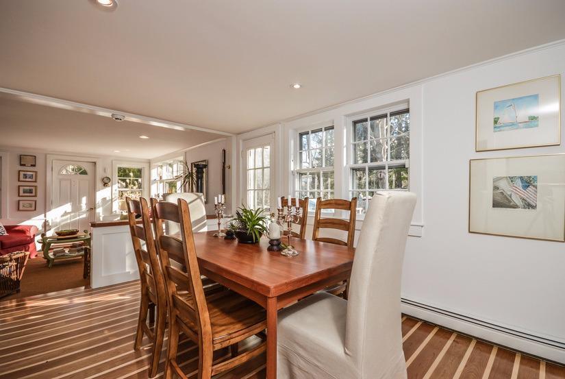 59 Lewis Pond Road Cotuit, MA 02635 - Photo 5 of 24 a view of a dining room with furniture and wooden floor