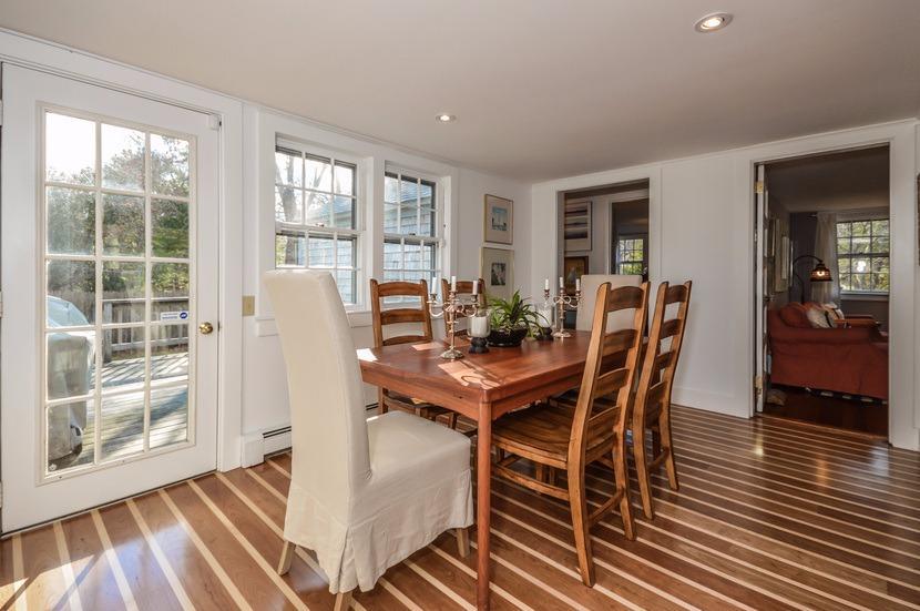 59 Lewis Pond Road Cotuit, MA 02635 - Photo 7 of 24 a view of a dining room with furniture and wooden floor