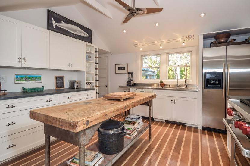 59 Lewis Pond Road Cotuit, MA 02635 - Photo 8 of 24 a kitchen with a sink stainless steel appliances and cabinets