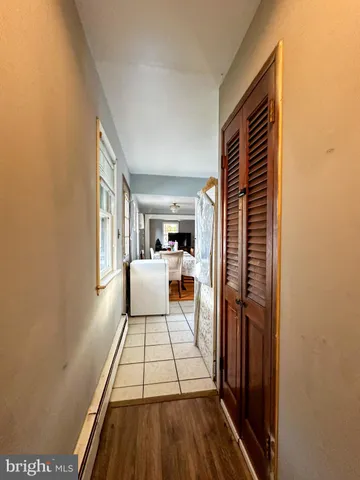 a view of a living room with a fireplace