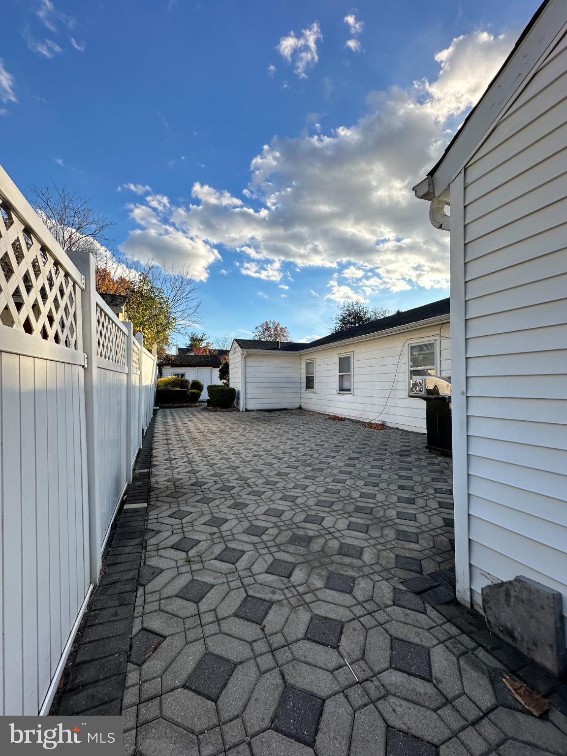 910 Magnolia Avenue Croydon, PA 19021 - Photo 25 of 33 Spacious patio under a vibrant sky.