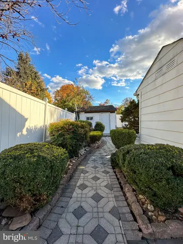 a view of a pathway with a yard