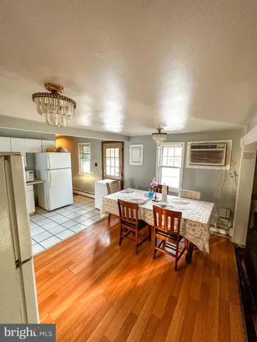 a view of a livingroom with furniture and a window