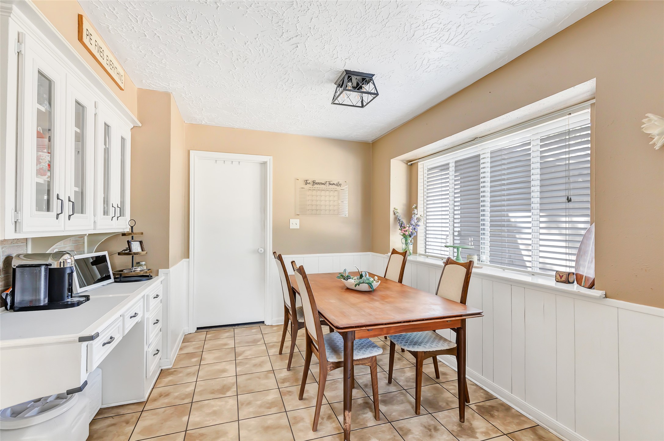 3 Baron's Place Conroe, TX 77304 - Photo 15 of 28 Sunlit breakfast area with wainscotting accent giving a cottage-style touch.