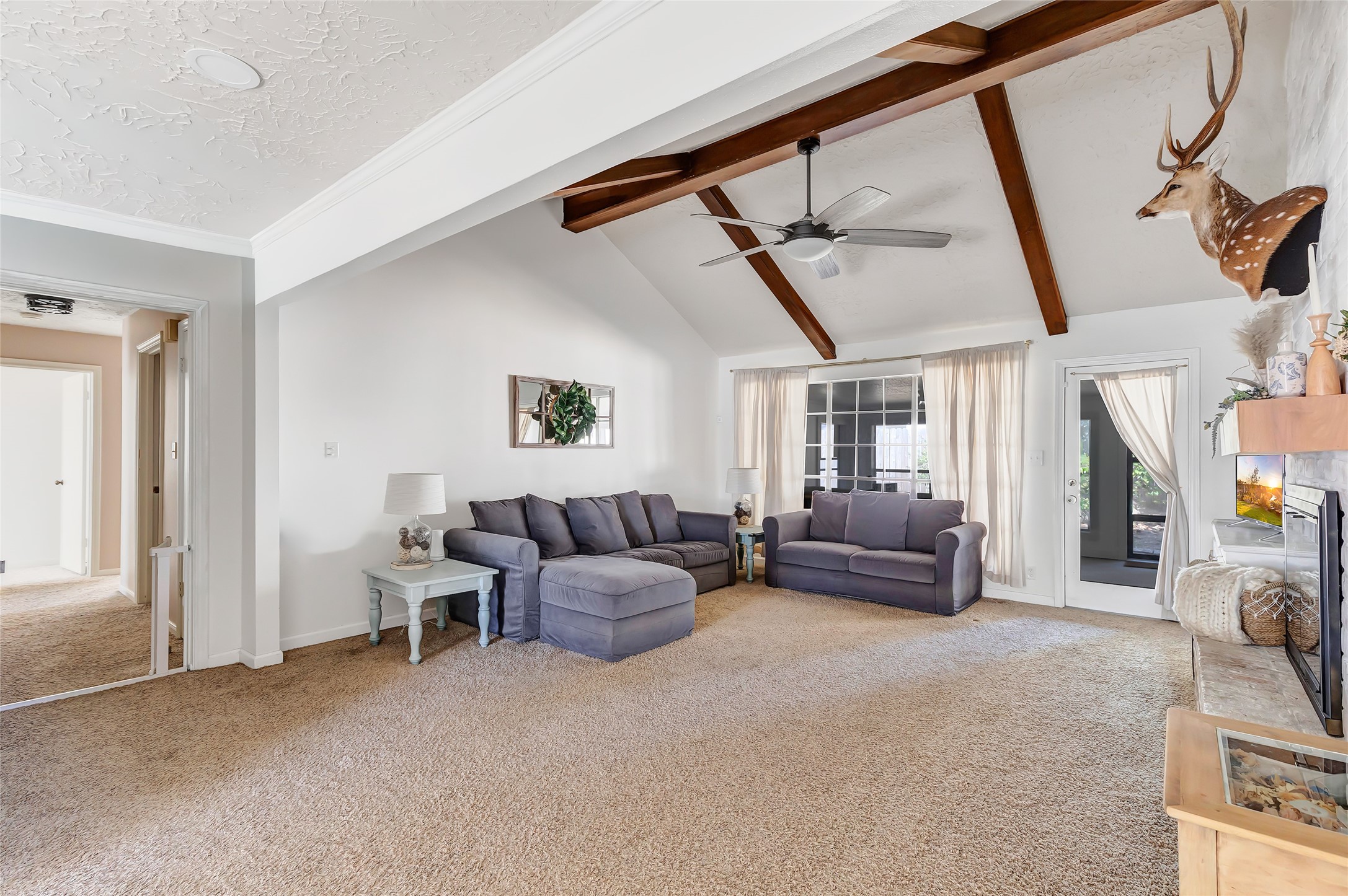 3 Baron's Place Conroe, TX 77304 - Photo 7 of 28 Natural light and updated paint help brighten the home