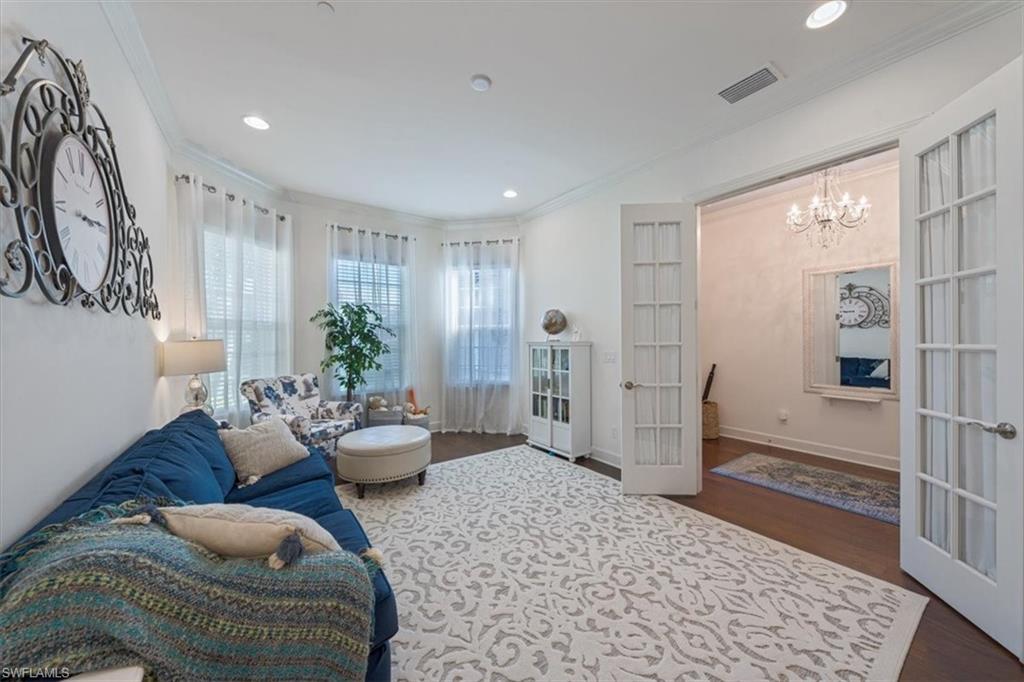 23734 Pebble Pointe Lane Estero, FL 34135 - Photo 11 of 34 a living room with furniture and wooden floor
