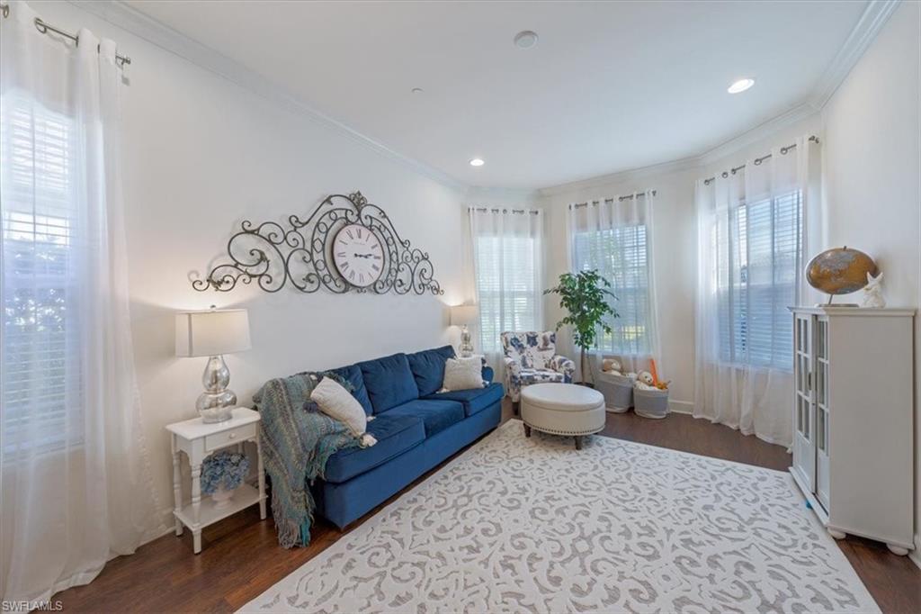 23734 Pebble Pointe Lane Estero, FL 34135 - Photo 12 of 34 a living room with furniture and wooden floor