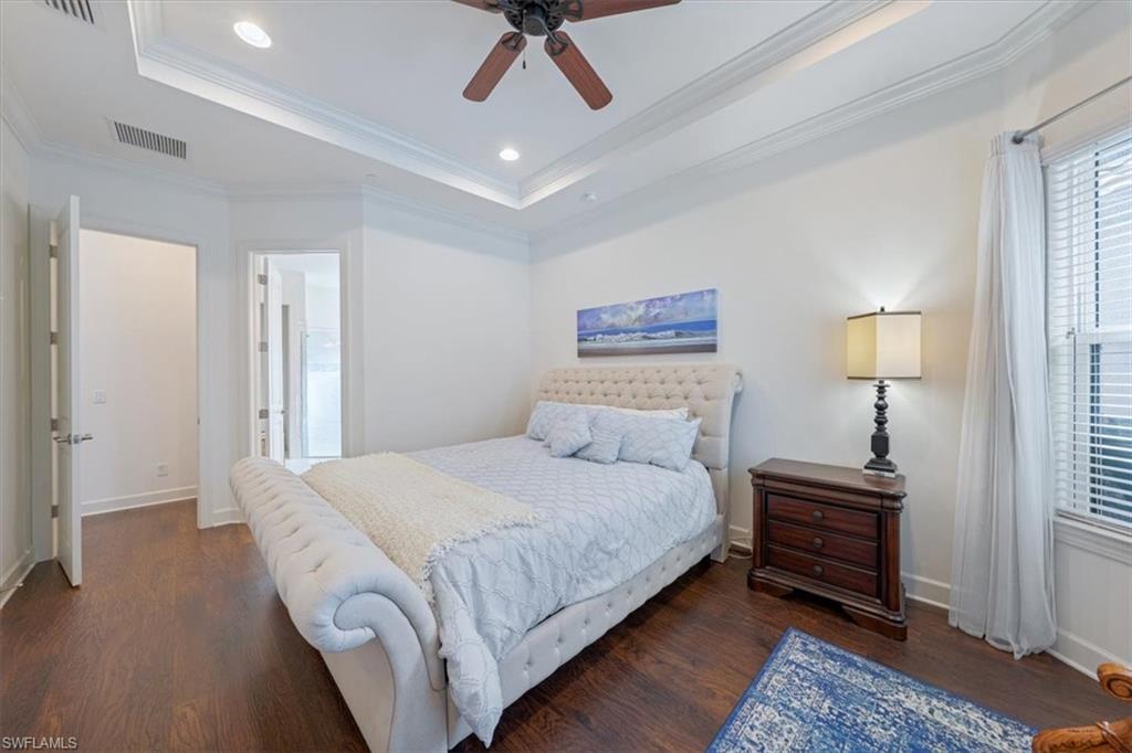 23734 Pebble Pointe Lane Estero, FL 34135 - Photo 14 of 34 a bedroom with a bed and a chandelier